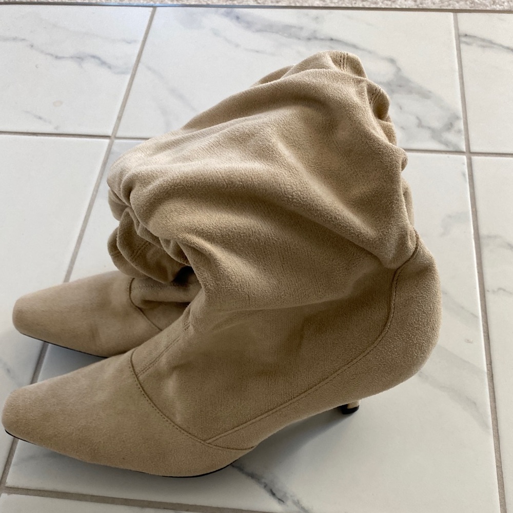 Cream/light tan boots with heel. Size 9.